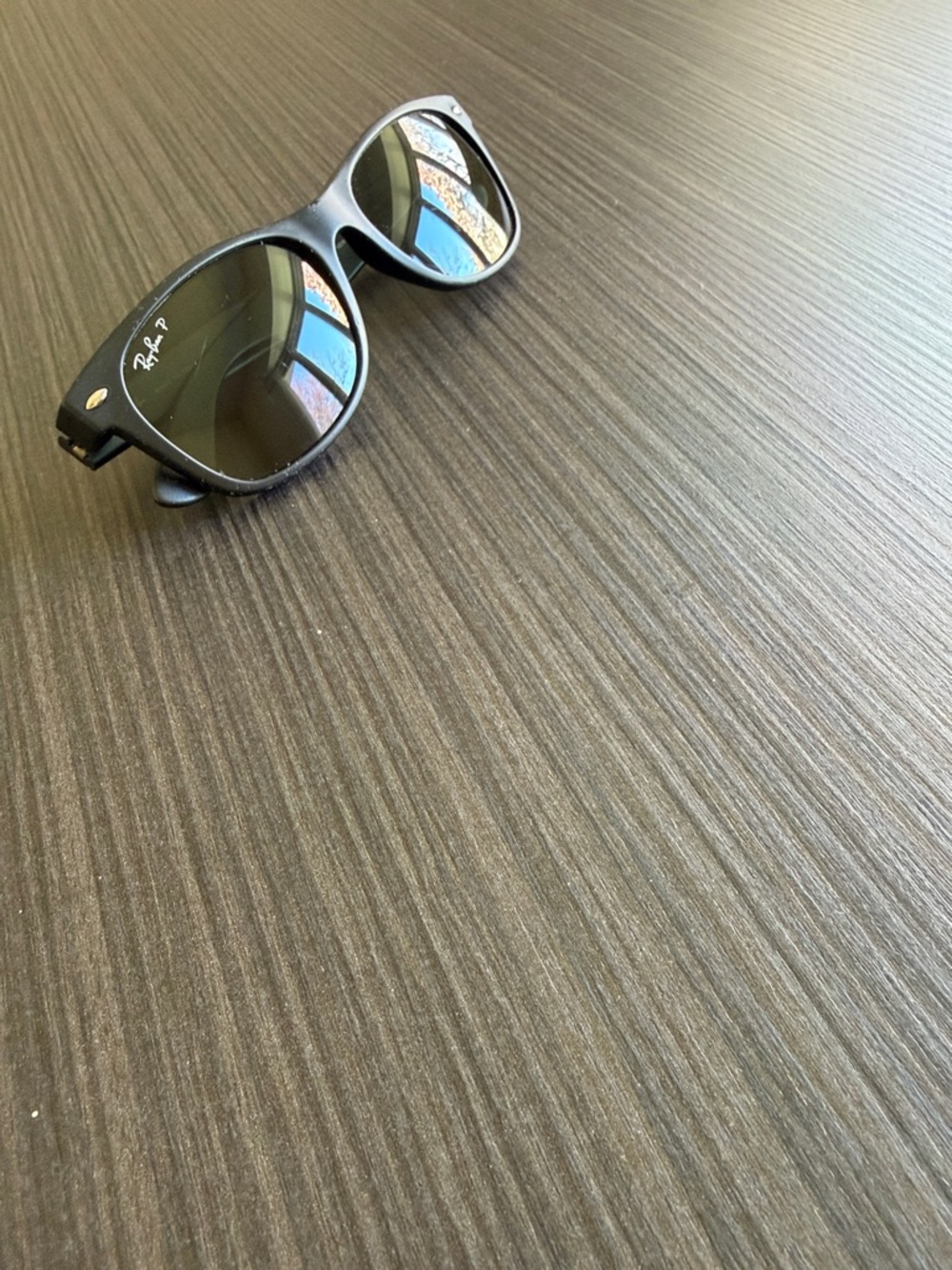 Ray-Ban Black Frame Polarized Sunglasses with Green-Tinted Lenses